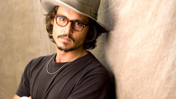 Jhonny Depp wearing a pair of glasses. 